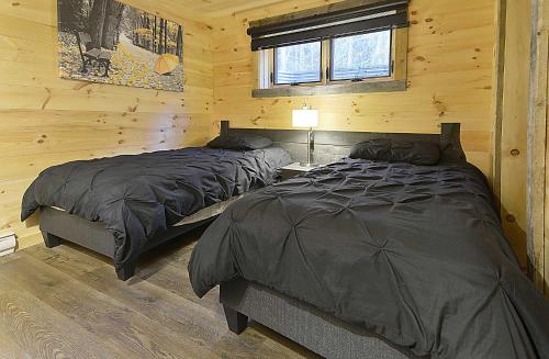 Les Chalets de Môh - 14 chalets indépendantsにあるベッド