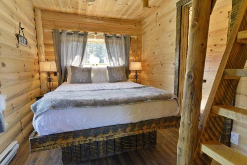 Les Chalets de Môh - 14 chalets indépendantsにあるベッド
