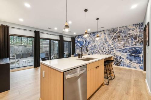 a kitchen with a sink and a dishwasher at Welcome to The Skyline Condo in Nashville