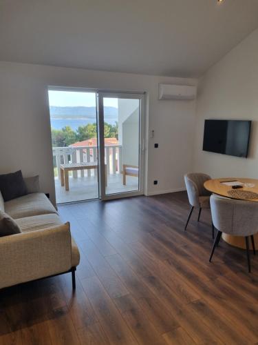 a living room with a couch and a table at Villa Mila in Bol