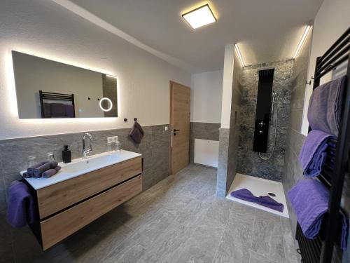 a bathroom with a sink and a shower at Studler-Eck in Oberperfuss