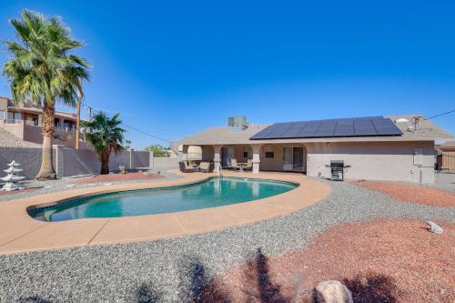 a house with a swimming pool in front of a house at Lake Havasu Home - 2 Mi from Main Launch Ramp! in Lake Havasu City