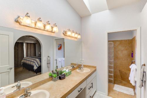 a bathroom with two sinks and a large mirror at Lake Havasu Home - 2 Mi from Main Launch Ramp! in Lake Havasu City