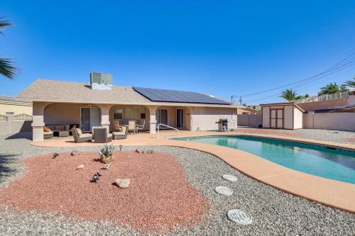 a house with a swimming pool in front of a house at Lake Havasu Home - 2 Mi from Main Launch Ramp! in Lake Havasu City