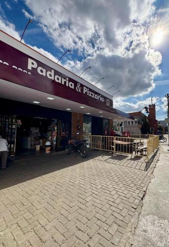 a store with a sign on the front of it at Conexão Mineira in Pedro Leopoldo