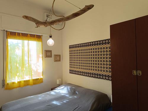 En eller flere senge i et værelse på Appartamento Scirocco