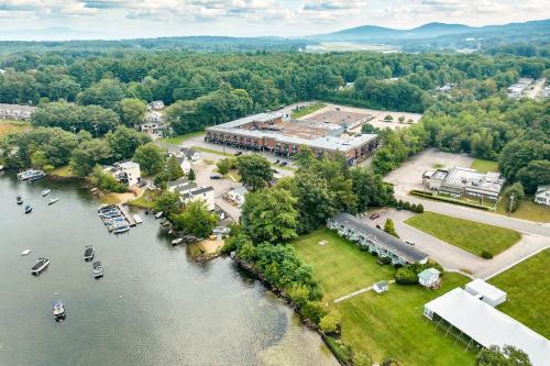 an aerial view of a building next to a river at Lakeview Escape, Pool, Fast Wi-Fi & Free Parking in Laconia