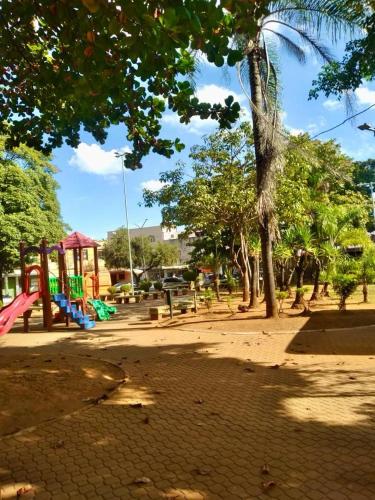 a park with a playground with trees at Conexão Mineira in Pedro Leopoldo