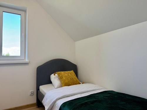 Ένα ή περισσότερα κρεβάτια σε δωμάτιο στο LOFT Apartments