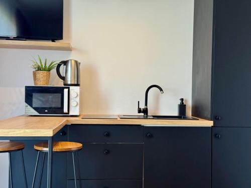 Η κουζίνα ή μικρή κουζίνα στο LOFT Apartments
