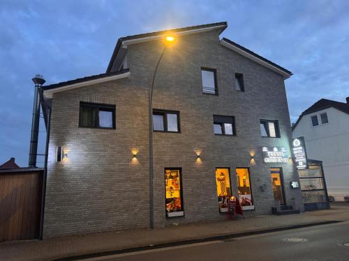 a brick building with a street light on it at Grand Hotel in Soltau