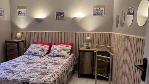 a bedroom with a bed with red pillows at villa vue mer avec piscine et jardin arboré in Coggia