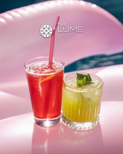 two cocktails on a table with a pink plate at The Lume Boutique Hotel & Restaurant & Spa in Bodrum City
