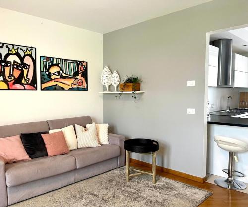 a living room with a couch and a table at Casa Altea in Pordenone