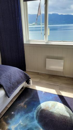 Ένα ή περισσότερα κρεβάτια σε δωμάτιο στο Apartment Fjordblick