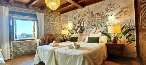 A bed or beds in a room at El Juacu