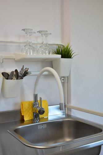 a kitchen sink with a faucet on top of it at Studio Bire in Lumbarda