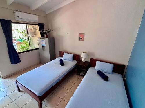 Postel nebo postele na pokoji v ubytování Casitas de la Paz