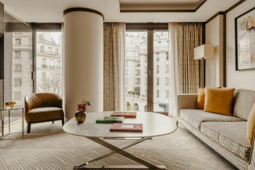 a living room with a couch and a table at Bvlgari Hotel Paris in Paris