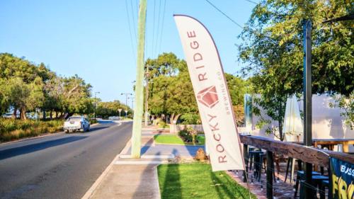 a sign on the side of a street at Peppermint Breeze in Vasse