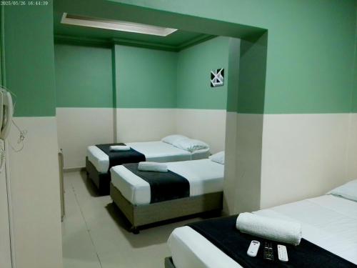 Ένα ή περισσότερα κρεβάτια σε δωμάτιο στο Hotel HIH
