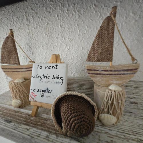 a sign on a table with two baskets and a boat at Casa de Almano - Torremolinos direct on beach in Torremolinos
