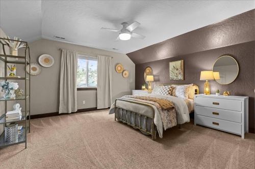 a bedroom with a large bed and a mirror at Winston's Luxurious Retreat in Coeur d'Alene