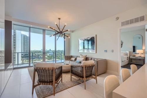 a living room with a couch and chairs at Amrit Resort - Bask in Rare Oceanfront Luxury with Stunning Views in Riviera Beach