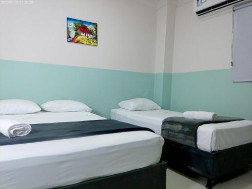 Ένα ή περισσότερα κρεβάτια σε δωμάτιο στο Hotel HIH