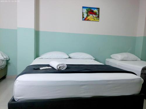 Ένα ή περισσότερα κρεβάτια σε δωμάτιο στο Hotel HIH