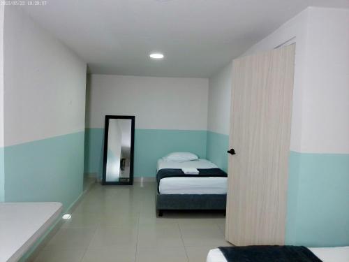 Ένα ή περισσότερα κρεβάτια σε δωμάτιο στο Hotel HIH