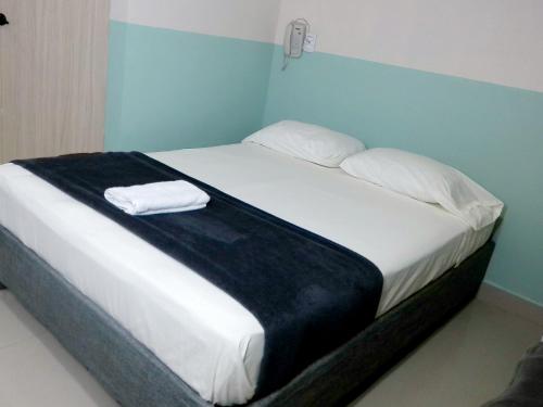Ένα ή περισσότερα κρεβάτια σε δωμάτιο στο Hotel HIH