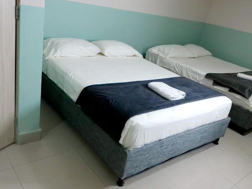 Ένα ή περισσότερα κρεβάτια σε δωμάτιο στο Hotel HIH