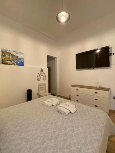 a bedroom with a bed with two towels on it at Lince Apartments in Lima