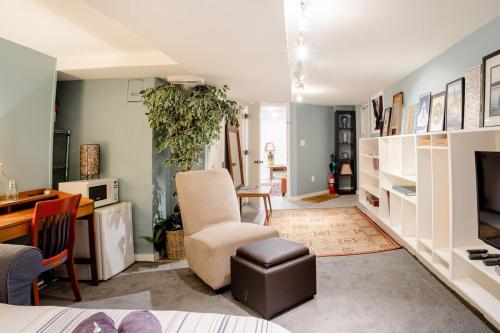 a living room with a chair and a desk at No Car Needed - N Beacon Hill Beauty in Seattle