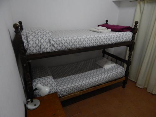 a couple of bunk beds in a room at Departamento Paz in Tandil