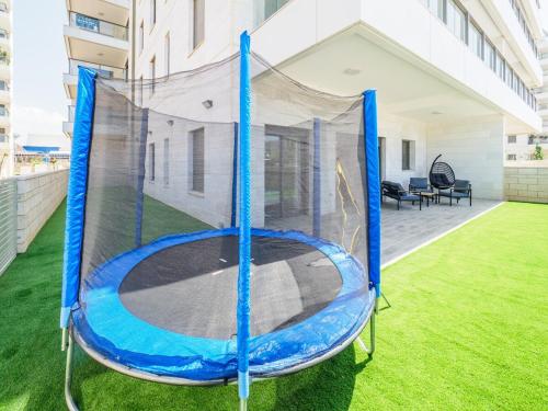 a trampoline on the roof of a house at Sea Serenity Achziv in Nahariyya