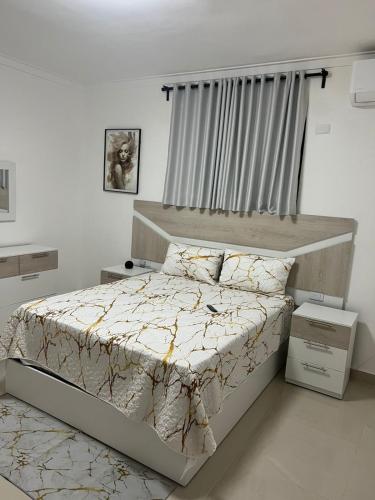 a bedroom with a large bed with a canopy at Residencial JL Francia II in Ensanche Savica de Mendoza