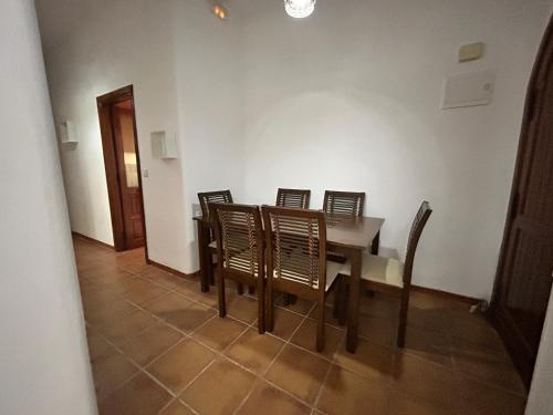 a dining room with a table and chairs at Cabo garden in Cabo Negro