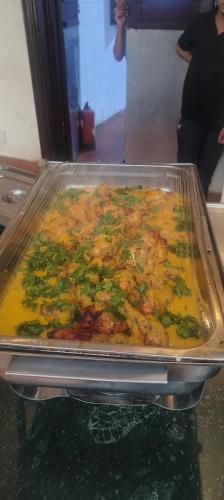 a pan of food with broccoli and other ingrediants at Badawia Sharm Resort in Sharm El Sheikh