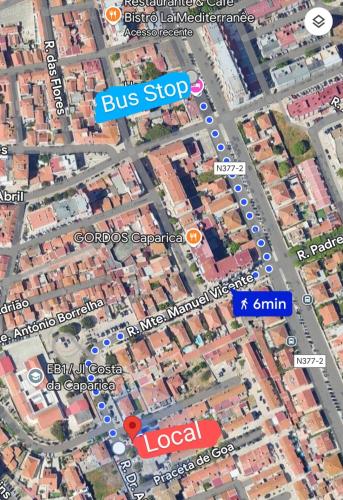 a bus stop sign on top of a map at We host in Costa da Caparica