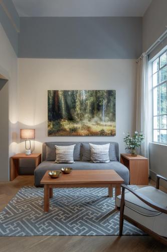 a living room with a couch and a table at Casa Bosque Eduviges in Guadalajara