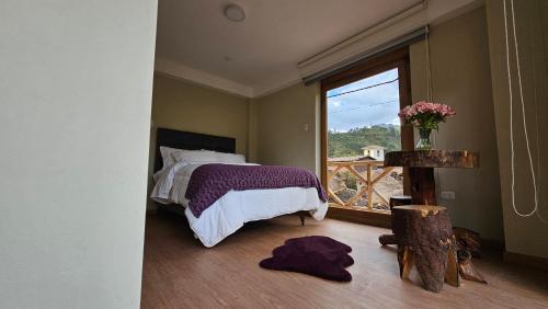 Cama o camas de una habitación en Amaru TreeHouse