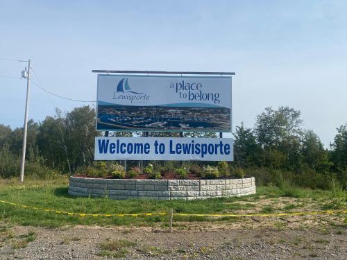 a sign that says welcome to lewitschotide at Bernice Mae's Ocean View in Lewisporte