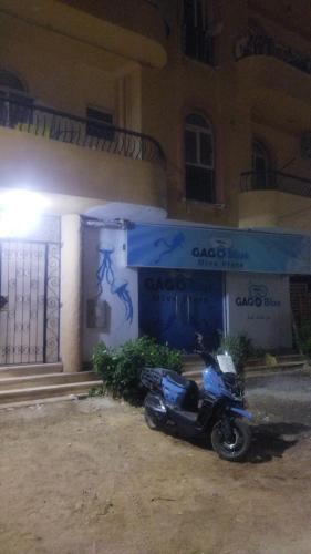 a motorcycle parked in front of a building at Hurghada City Apartment2 in Hurghada