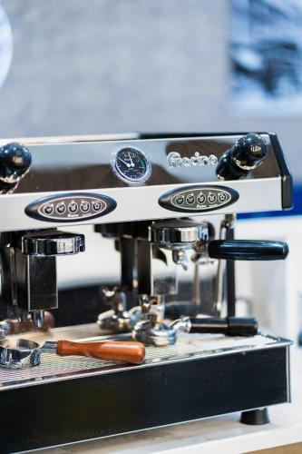 a coffee machine with a hot dog on it at Hotel LIV in Birmingham