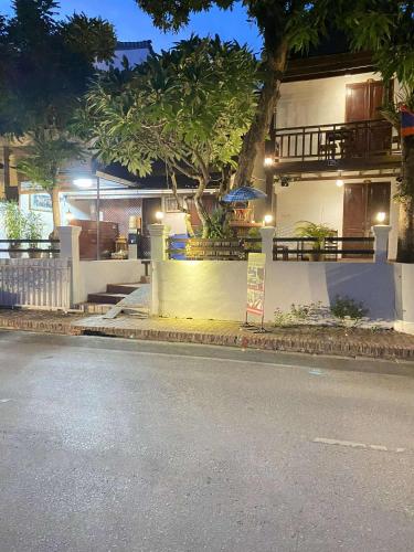 a building on the side of a street at night at Luang Prabang Golden Lotus Villa River View in Luang Prabang