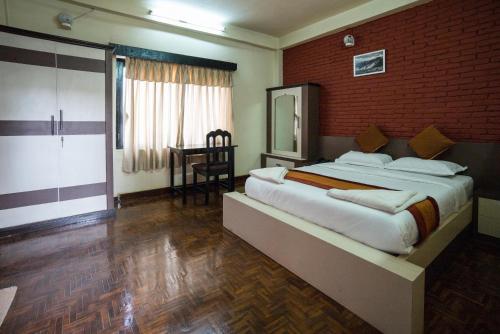 Postel nebo postele na pokoji v ubytování Planet Bhaktapur Hotel