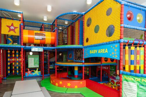 an indoor play area with a play arena at Daisy-Jacks Hideaway in Briery Yards