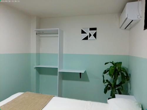 Ένα ή περισσότερα κρεβάτια σε δωμάτιο στο Hotel HIH